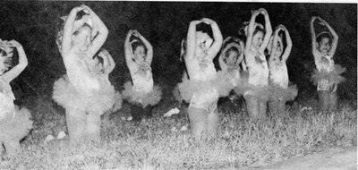 Dancers from Ms. Rhonda’s School of Dance portray bluebonnets popping up from the ground.